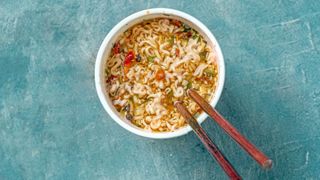 Noodles in pot with chopsticks