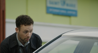 Andrew Buckley getting into a cab in Death in Paradise