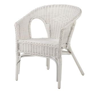 A white wicker chair, available from Wayfair
