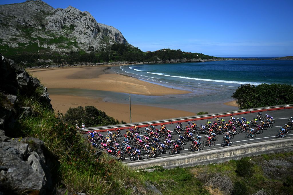 CASTRO URDIALES SPAIN MAY 06 A general view of the peloton passing through a sea landscape during the 9th La Vuelta Femenina 2023 Stage 6 a 1061km stage from Castro Urdiales to Laredo UCIWWT on May 06 2023 in Castro Urdiales Spain Photo by Dario BelingheriGetty Images