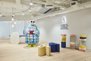 Office space in Dubai by Pallavi Dean with large scale monster-like figure in blue and soft furnishings