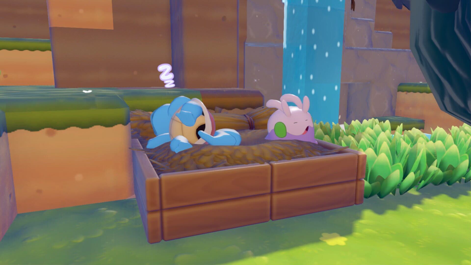 Squirtle and Goomy sleeping together in a bed in Pokemon Pokopia