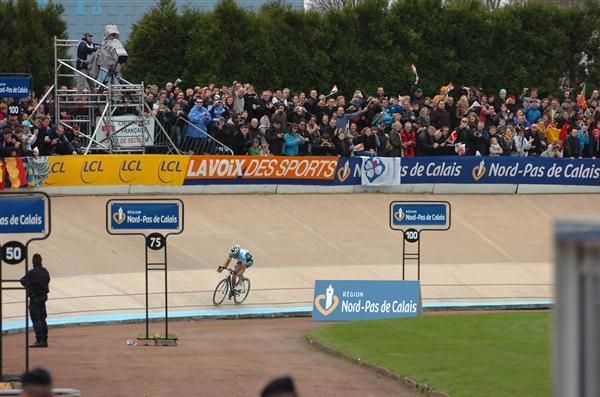 Boonen rides round the velodrome at the finish of Paris-Roubaix 2012