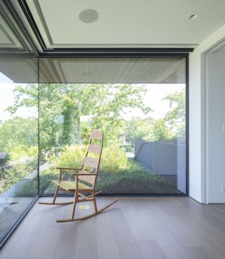 Corner window with rocking chair at Lake House by Worrell Yeung