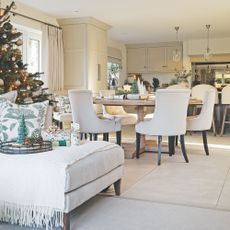 Dining room and a sofa decorated for christmas