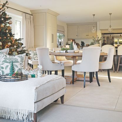 Dining room and a sofa decorated for christmas
