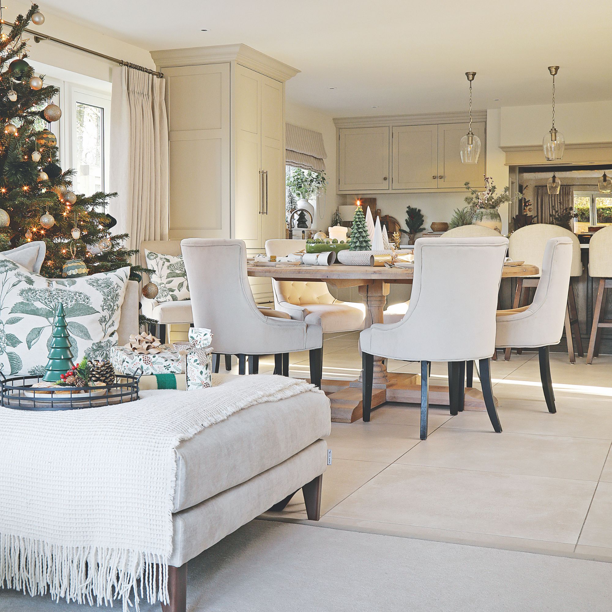 Dining room and a sofa decorated for christmas