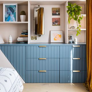 Bedroom with blue upcycled IKEA chest of drawers.