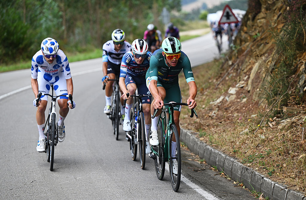 MONFORTE DE LEMOS, SPAIN - SEPTEMBER 07: (L-R) Jay Vine of Australia and UAE Team Emirates - XRG - Polka dot Mountain Jersey and Mads Pedersen of Denmark and Team Lidl - Trek - Green Points Jersey compete in the breakaway during the La Vuelta - 80th Tour of Spain 2025, Stage 15 a 167.8km stage from A Veiga-Vegadeo to Monforte de Lemos / #UCIWT / on September 07, 2025 in Monforte de Lemos, Spain. (Photo by Dario Belingheri/Getty Images)
