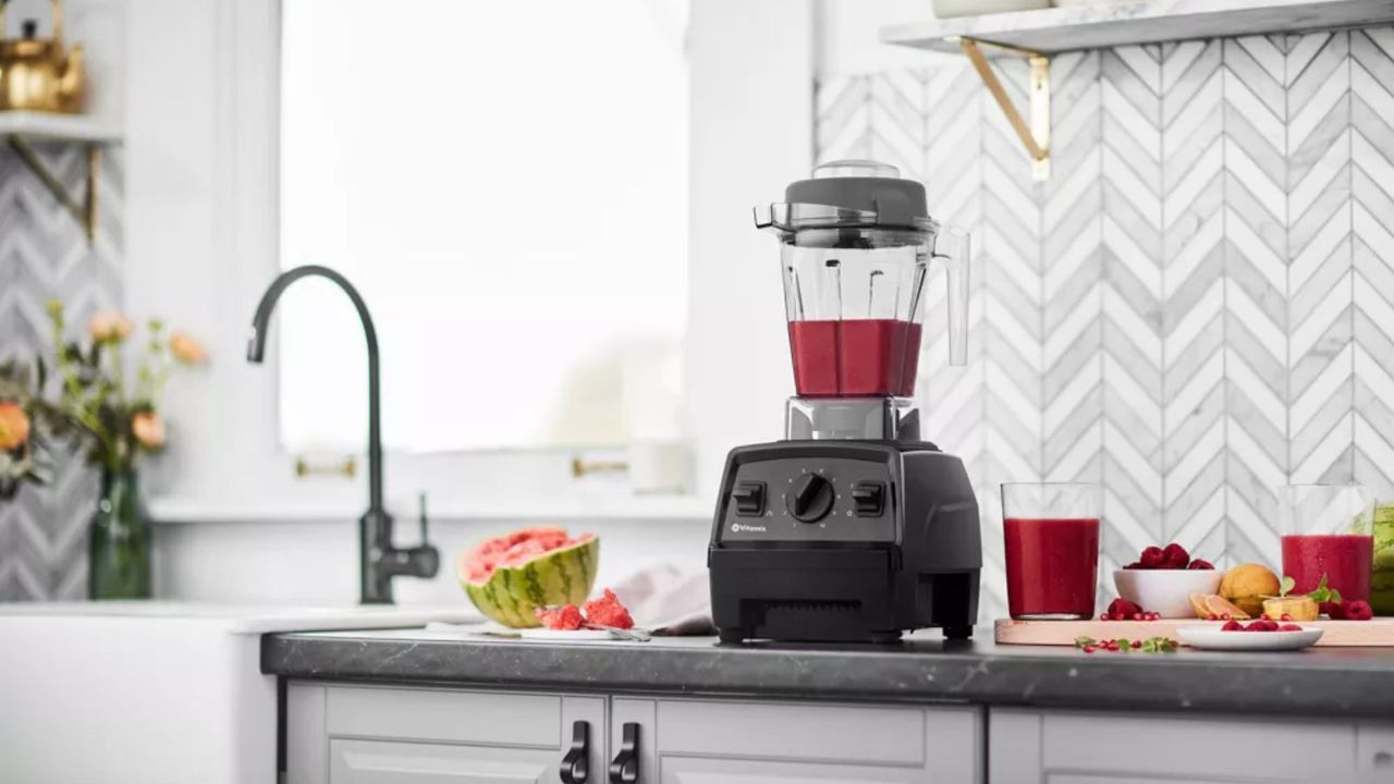 a Vitamix Explorian E310 blender making a melon smoothie