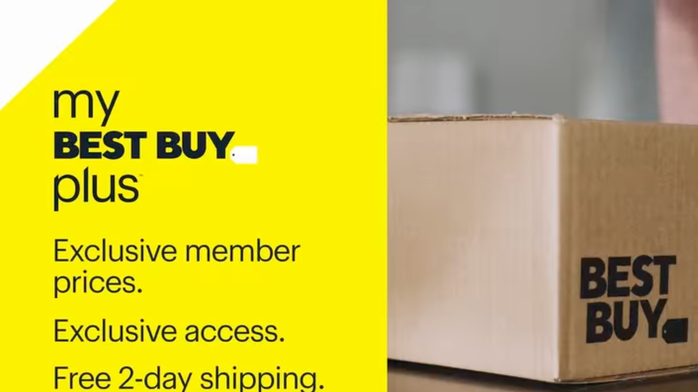 A promotional graphic for My Best Buy Plus features the membership&#039;s benefits on a yellow background next to a cardboard box with the Best Buy logo on it.