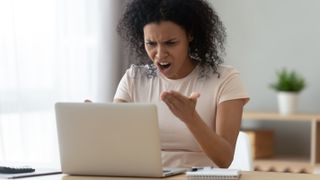 Woman swearing at PC