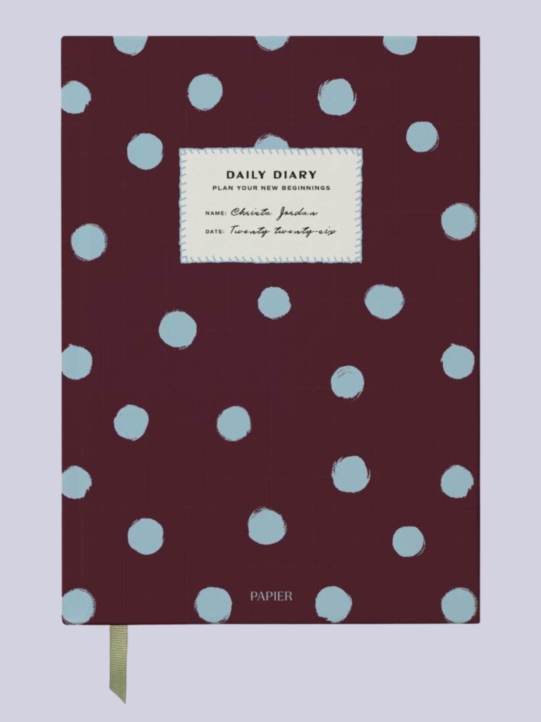 A brown journal with blue spots