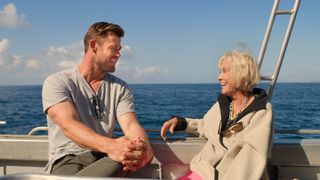 Chris Hemsworth learns about shark conservation from Valerie Taylor.