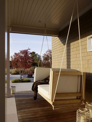 A deck with a swing