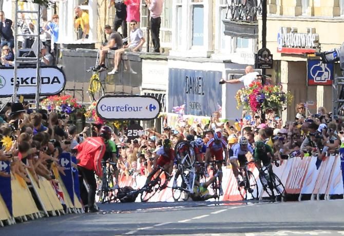 The sprinters try to avoid the falling Mark Cavendish and Simon Gerrans