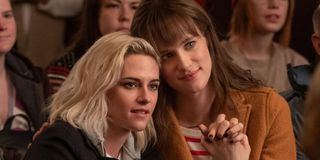 Kristen Stewart And Mackenzie Davis holding hands during Happiest Season