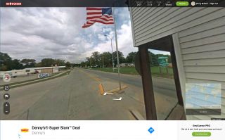 Screenshot of street with American flag