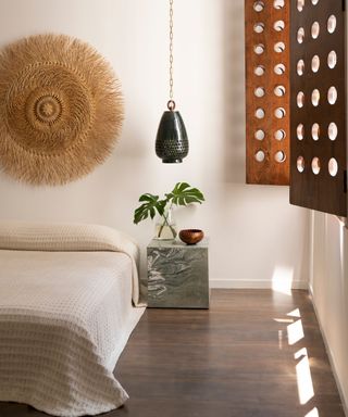 bedroom with white walls and cutout shutters