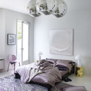 bedroom with Mirror balls and glass door