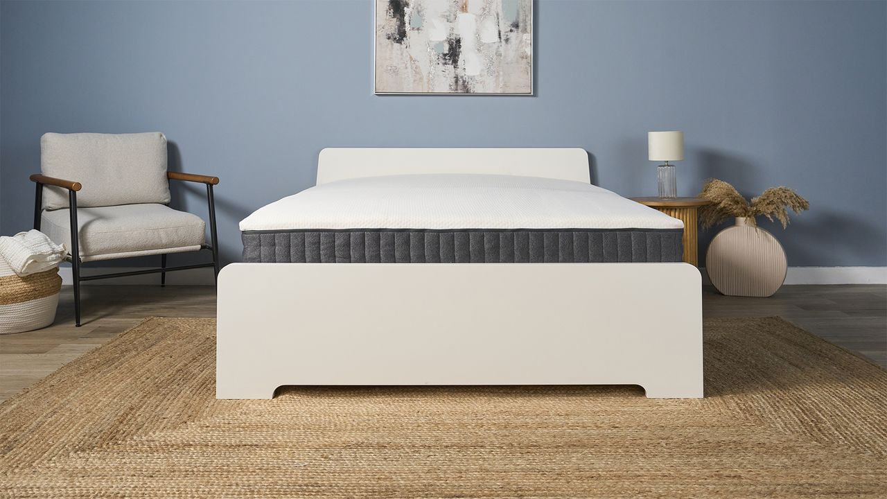The Emma Elite Mattress on a bed frame in a bedroom