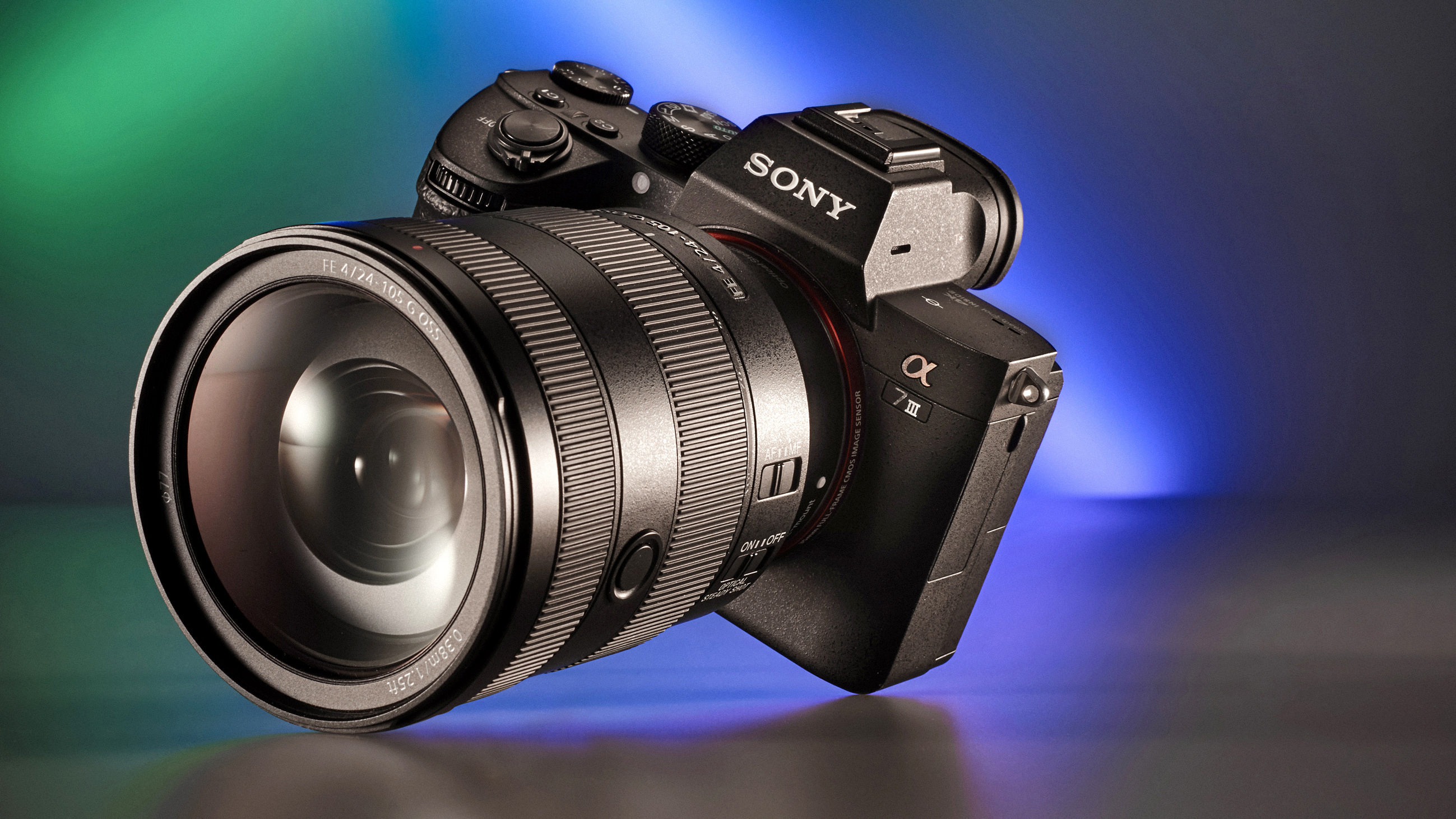 A Sony Alpha 7 III camera with a large lens, showcased against a softly lit gradient background in green and blue hues