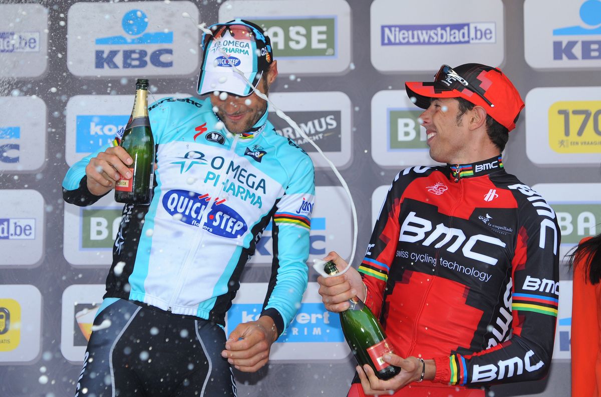 Tom Boonen and Alessandro Ballan spray the champagne on the podium