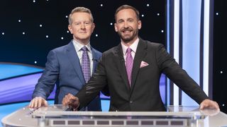 Ken Jennings stands with Brad Rutter on Jeopardy! Masters in 2025.