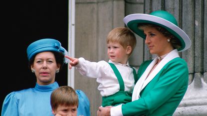 LONDON, UNITED KINGDOM - JUNE 11: Diana, Princess Of Wales, Holding A Young Prince Harry In Her Arms As She Watches Trooping The Colour With Prince William And Princess Margaret From The Balcony Of Buckingham Palace. (Photo by Tim Graham Photo Library via Getty Images)