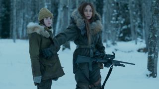 Lucy Paez stands beside Jennifer Lopez protecting her with a gun in The Mother.