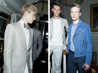Guys wearing Gieves & Hawkes S/S 2015 collection. The guy on the left is wearing a formal white shirt, bow tie, chalky white jacket and white pants. On the right the first guy is wearing a white jersey, chalky pants and a striped chalky white jacket and next to him the guy is wearing a blue shirt, a sky blue jacket with zips and a navy pants