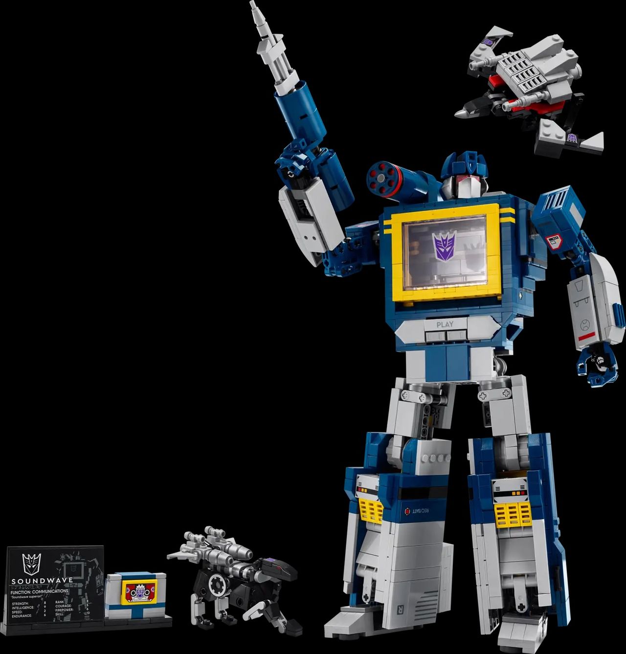 LEGO Transformers Soundwave with accessories holding his arm up with a shooter in hand