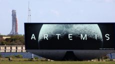 NASA's Artemis II Space Launch System (SLS) rocket and Orion spacecraft are seen at Launch Pad 39B at the Kennedy Space Center in Cape Canaveral, Florida on March 20, 2026. NASA on March 19 began returning its towering SLS rocket and Orion spacecraft to its Florida launch pad ahead of a planned flyby of the Moon, after completing necessary repairs. Artemis engineers began the maneuver, which can take up to 12 hours, at 8:00 pm eastern, after which the US space agency will begin final preparations before its next launch window opens on April 1. (Photo by Gregg Newton / AFP via Getty Images)