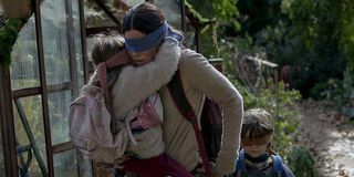 Sandra Bullock blindfolded with Children in Bird Box