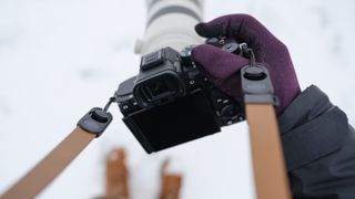 The Sony A7 V covered in snow
