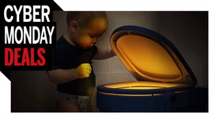 A child looking into a glowing toilet bowl