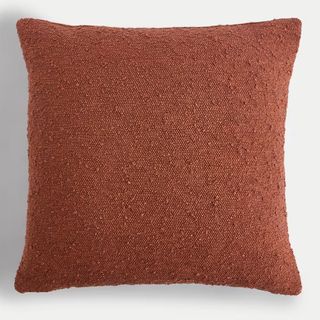 Rust coloured textured boucle square cushion