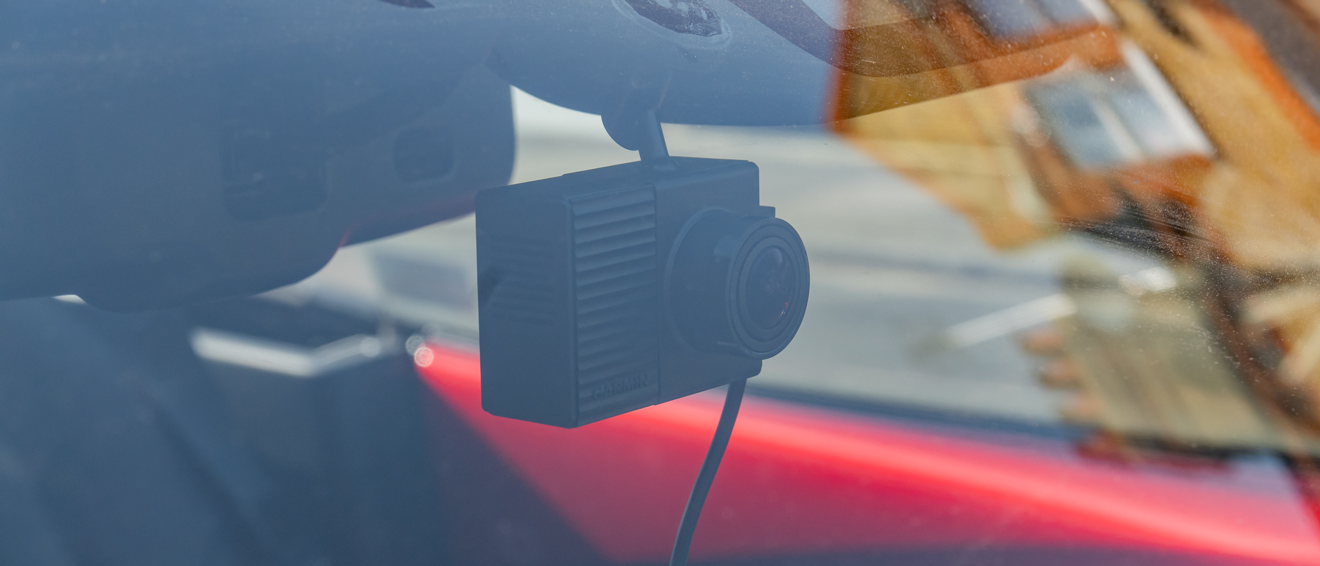 The Garmin Dash Cam Tandem mounted in a windshield