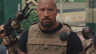 Dwayne Johnson angrily takes part in a raid in Fast Five.