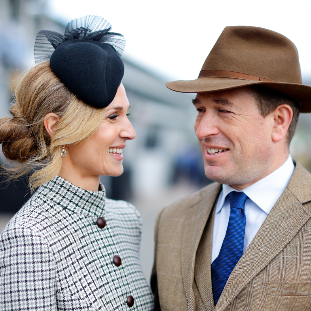 Harriet Sperling and Peter Phillips smiling at each other at Cheltenham races wearing hats