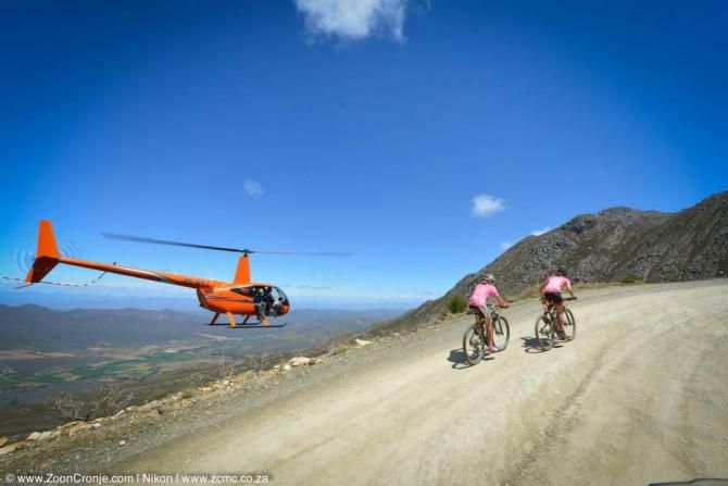 Team RE:CM Davinci's Annika Langvad (left) and Ariane Kleinhans approach the summit of the Swartberg Pass on their way to winning the women's category in stage 2