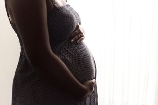 A pregnant woman.