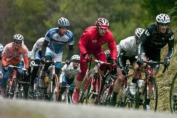 Peter McDonald (red) of Drapac Porsche in the peloton on stage four.