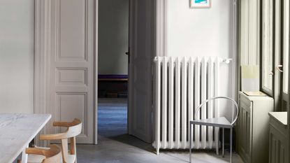 a room with an ornate door painted in soft shades