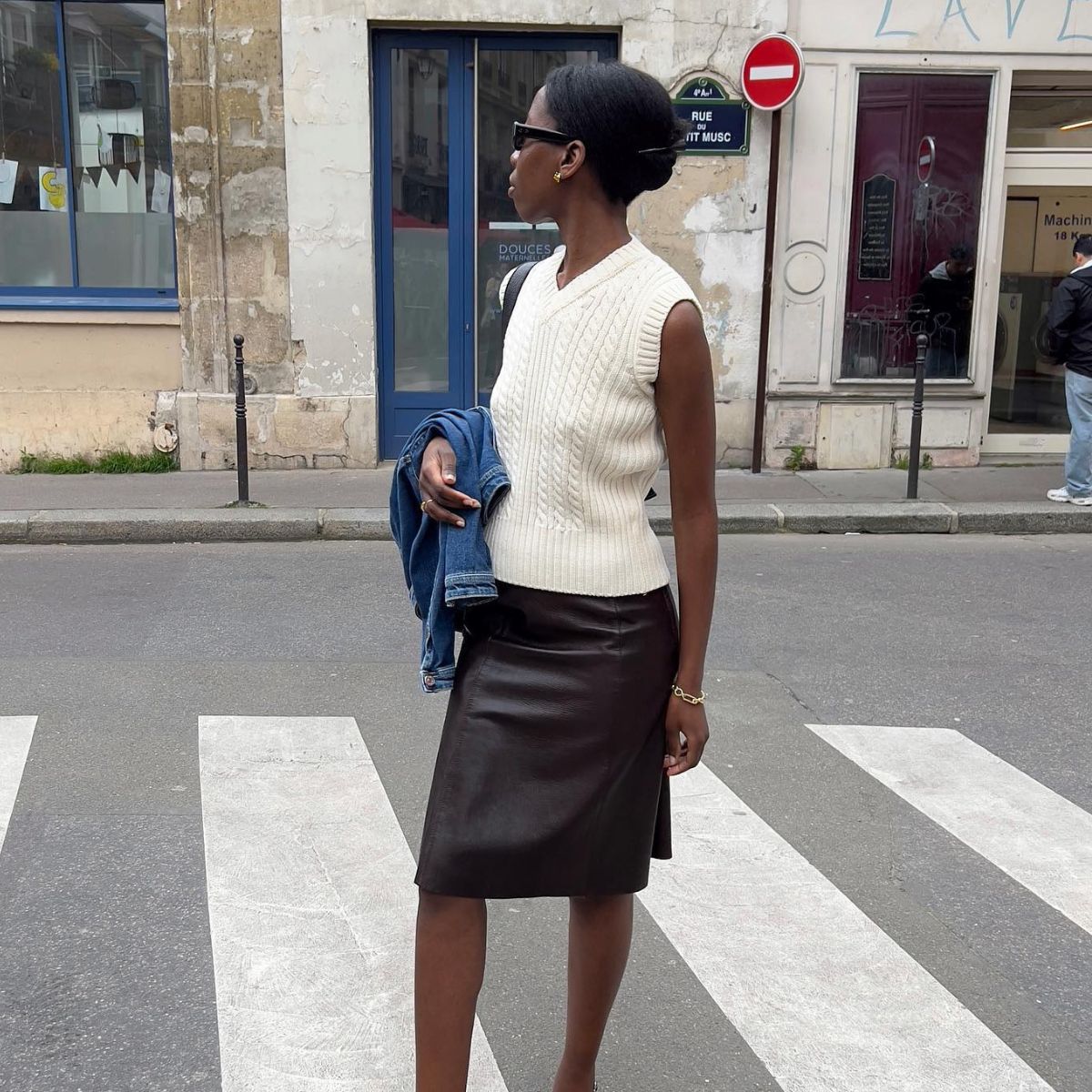 An image of @sylviemus_ wearing a chic sweater vest outfit. 