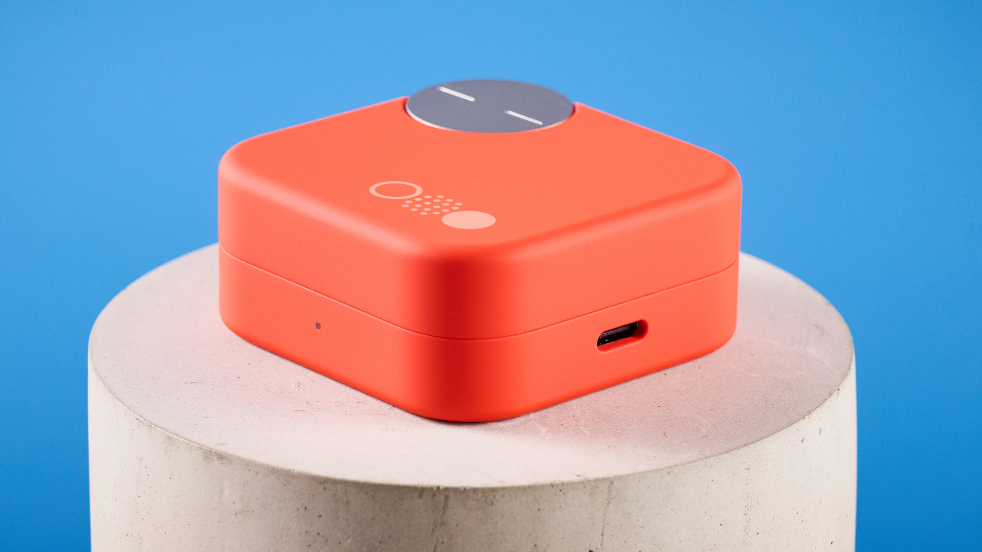 the nothing cmf buds pro 2 cmf by nothing buds pro 2 in bright orange shown in the smart dial charging case against a blue tom&#039;s guide background