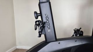 Wattbike Proton smart bike, a close-up photo of the handlebar knob and drink holder