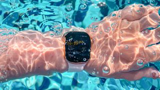 Apple Watch shown under water in swimming pool