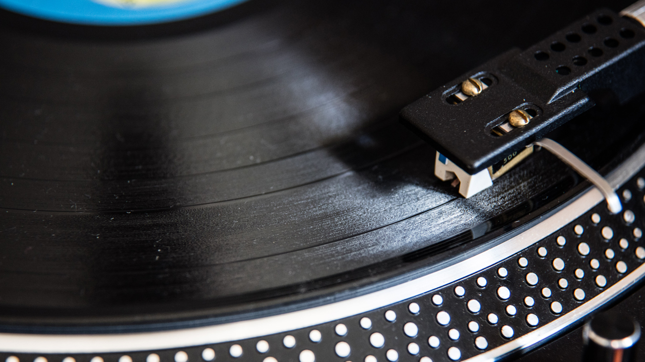 A photograph of a vinyl record on a turntable