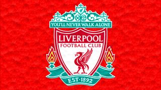 Liverpool FC badge on a bright red wall